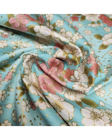 Japanese cotton satin slub fabric "Hanafubuki" in light blue.