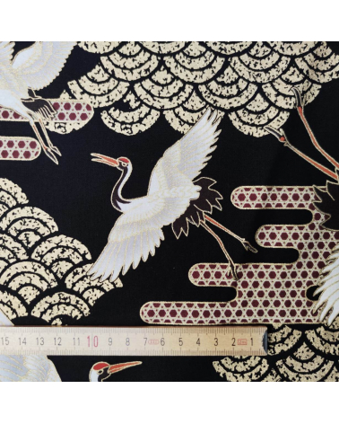 Japanese fabric. Flying Cranes and Clouds over black.