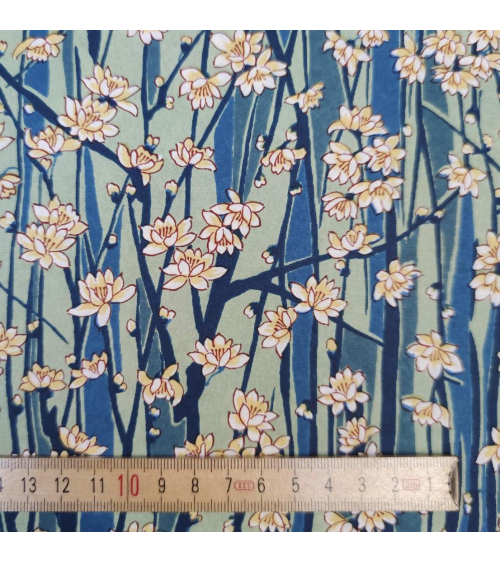 Japanese Chiyogami paper of magnolia flowers over blue and green