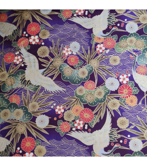 Japanese cotton fabric of cranes in violet with golden details.