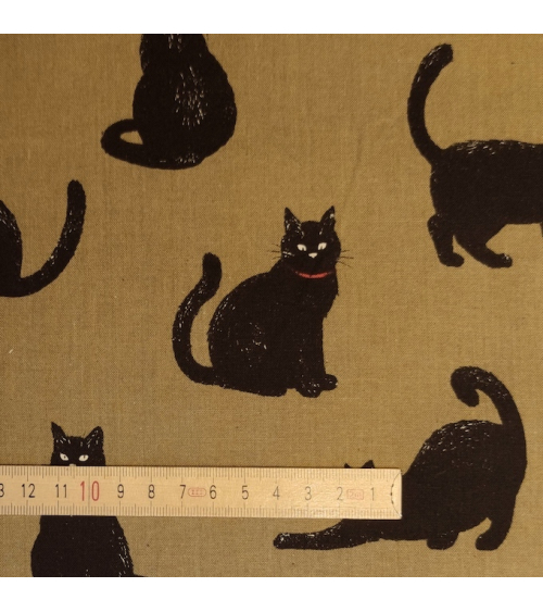 Japanese Fabric 'Cats' over kaki green background.