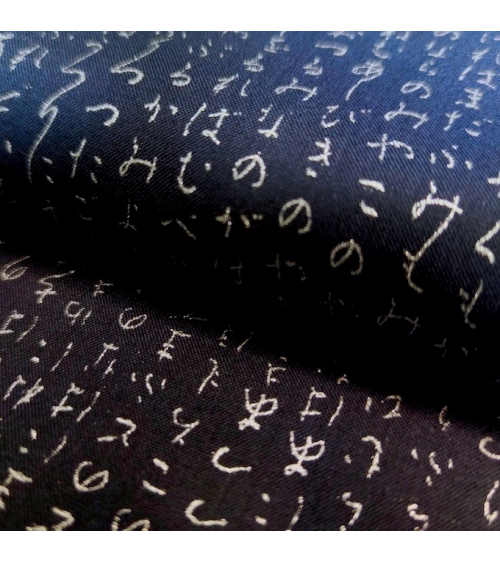 Japanese fabric. Hiragana in silver over navy blue.