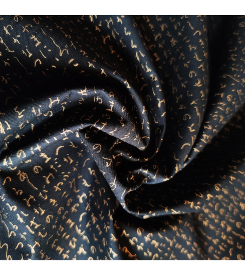 Japanese fabric. Hiragana in gold over black.