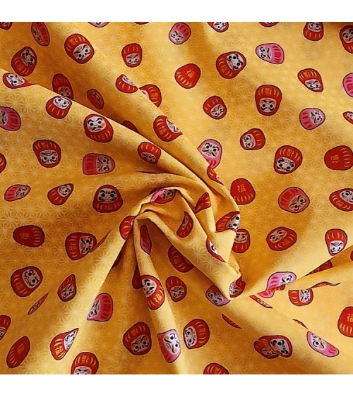 Japanese 100% cotton fabric "Darumas and asanoha" in yellow.