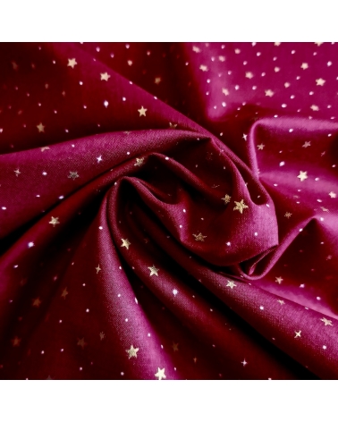 Japanese fabric with golden stars on a cherry red background