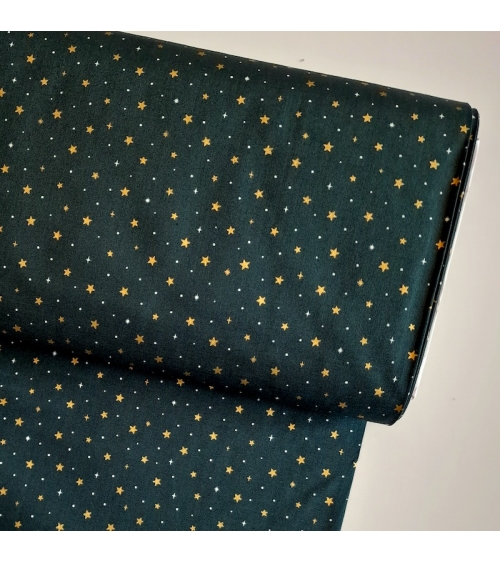 Japanese fabric with golden stars on a fir green background