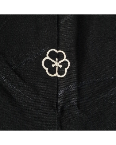 Black vintage haori with subtle motif and kamon crest.