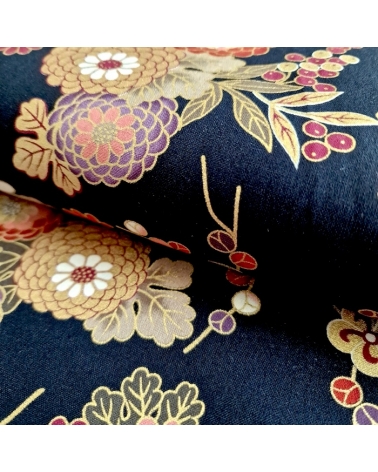 Japanese fabric 'Flowers and bamboo' in autumn colours on black.