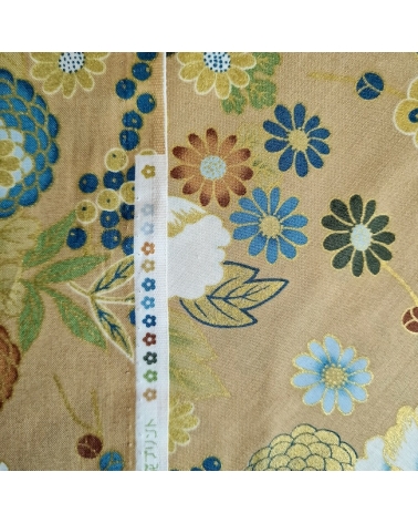 Japanese fabric 'Flowers and bamboo' in bluish colours on tan.