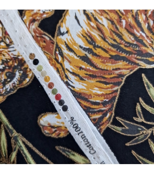 Japanese cotton fabric 'Tigers and bamboo', with golden highlights, in black.