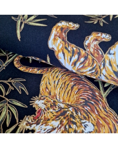 Japanese cotton fabric 'Tigers and bamboo', with golden highlights, in black.