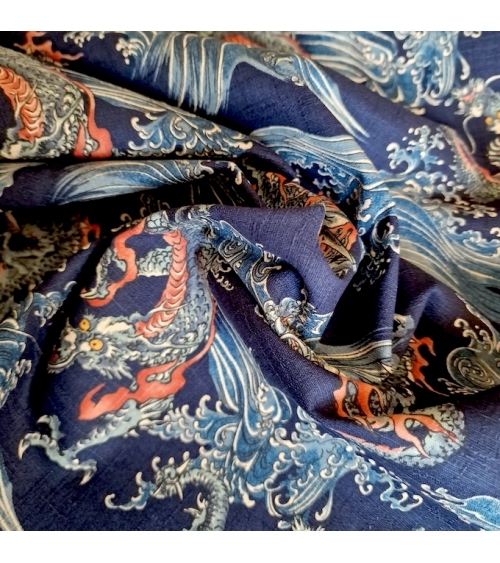 Japanese dobby fabric with small dragons and waves in blue.