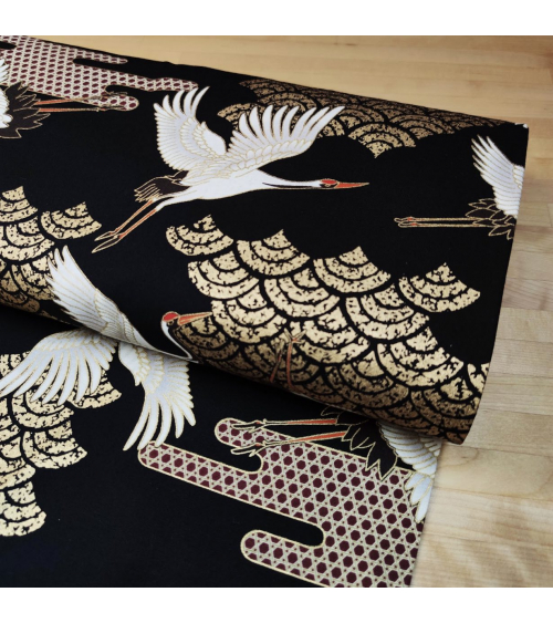 Japanese fabric. Flying Cranes and Clouds over black.